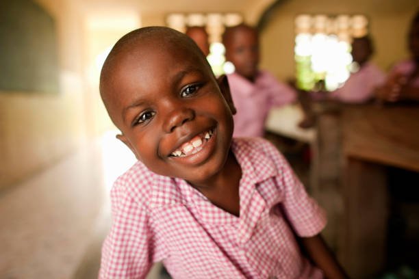 A smiling sponsored student